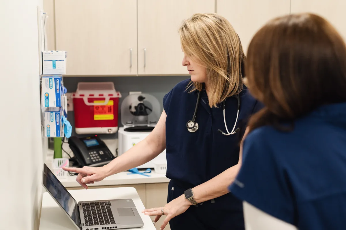 Carolina Medical Group clinician reviewing care information with a patient