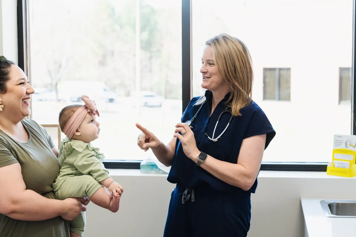 Clinician caring for a young child at Carolina Medical Group