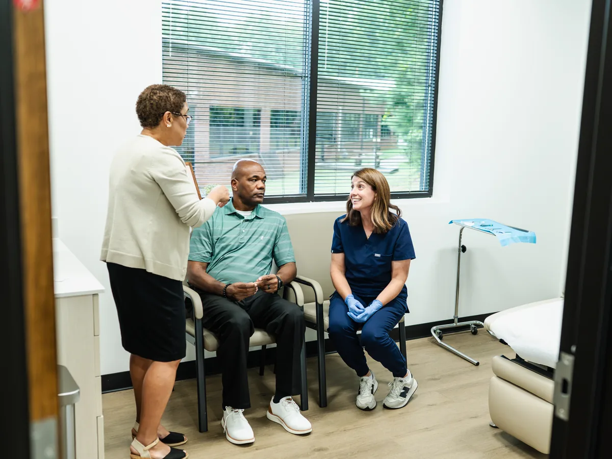 Carolina Medical Group team speaking with patients during an office visit