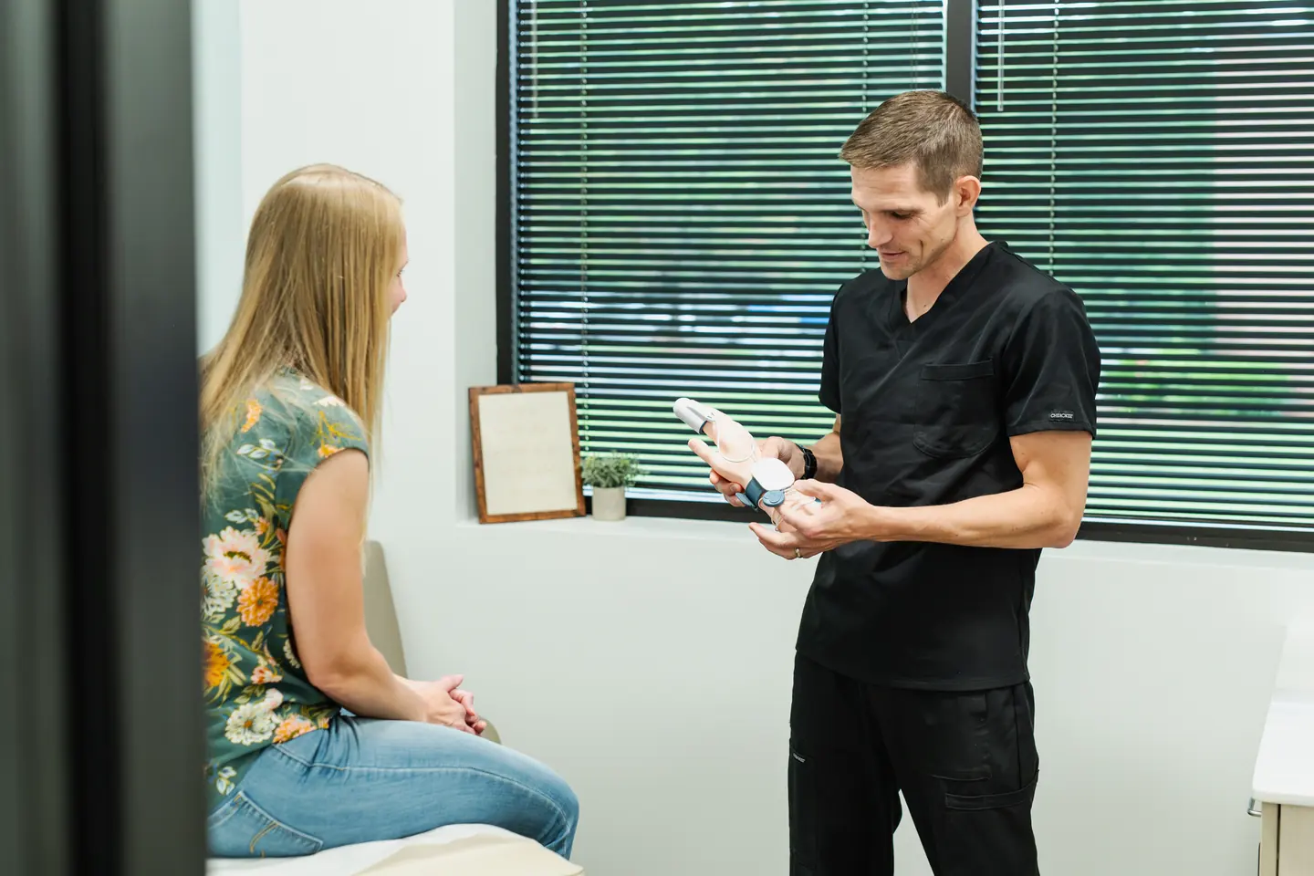 Dr. David Merrell discussing a care option with a patient
